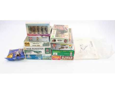 A group of 11 mixed mainly Airfix boxed kits to include a M.G.B Roadster parts still in sealed bag and a 1:72 scale Roman tro