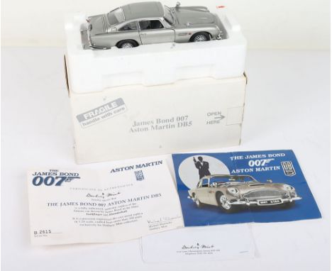 The James Bond Aston Martin DB5 007 by Danbury Mint Scale 1:24, Collector Quality replica of James Bond’s most memorable secr