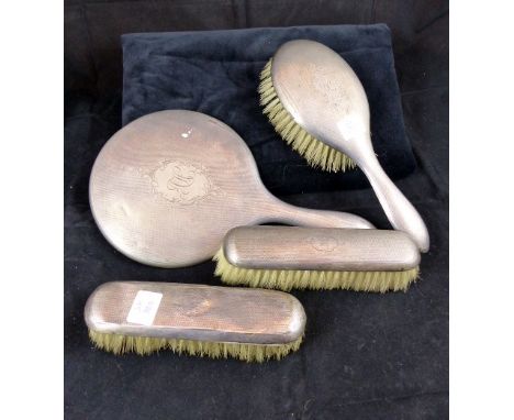 Set of hallmarked silver dressing table mirror and brushes with monogramed cartouche. Assay Chester 1911