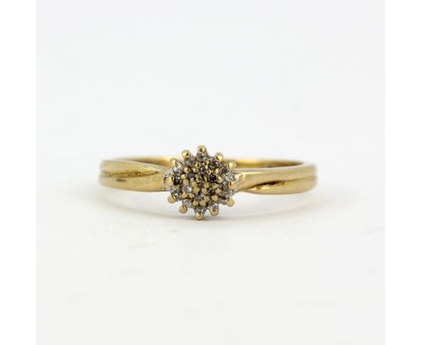 A hallmarked 9ct yellow gold diamond set cluster ring, (M.5).