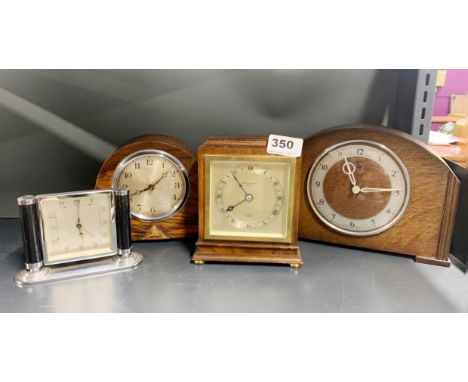 A Mappin and Webb mantel clock with two further oak mantel clocks and an Art Deco alarm clock, Mappin and Webb clock H. 15cm.