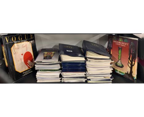 A collection of Moorcroft collector's club magazines with a copy of Moorcroft a New Dawn and the Art of Vogue covers.