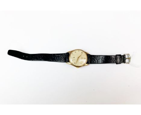 A gent's 9ct gold Omega manual wristwatch with 1959 engraving on the reverse. Appears to be in working order.