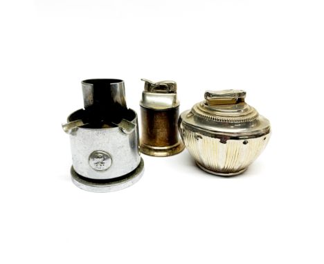 A Colibri silver plated table lighter with an Evans, for Tiffany &amp; Co. table lighter and a 1942 military shell ashtray, t