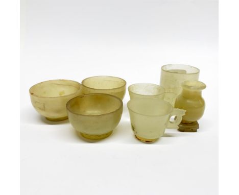 A group of 19th/ early 20th C Chinese turned and carved nephrite jade cups, tallest 5.2cm.