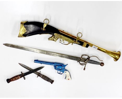A reproduction brass blunderbuss, L. 70cm together with a Spanish sword, two daggers and a Rangerider Lone Star mark II toy g