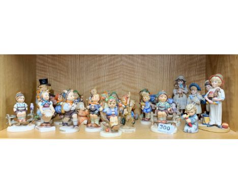 An extensive group of Goebel and other figurines, tallest H. 14cm.