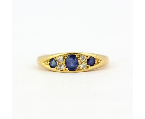 An 18ct yellow gold sapphire and diamond set ring, (M).