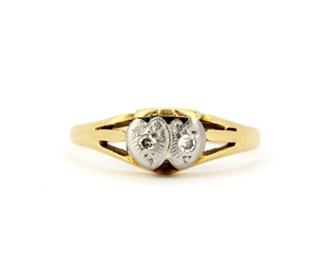 An 18ct gold and platinum diamond set ring, (L), gross weight approx. 2.7gr.&nbsp;