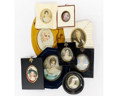 A group of framed portrait miniatures.