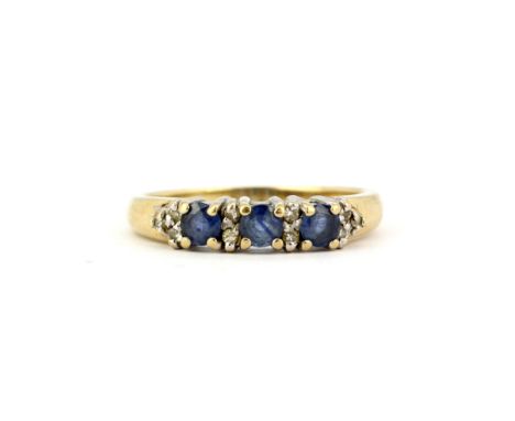 An 18ct yellow gold ring set with round cut sapphires and diamonds, (N).