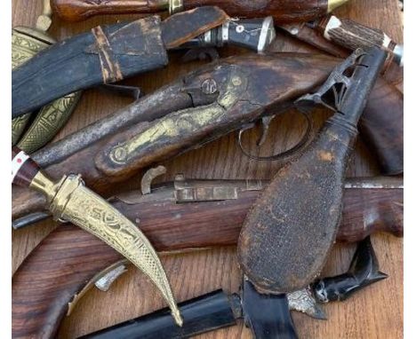 A collection of various Flintlock pistols, daggers a powder flask and similar, Faults