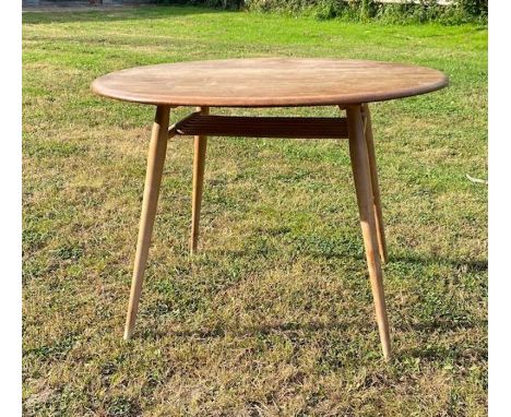 A mid century blond Elm Ercol pebble table