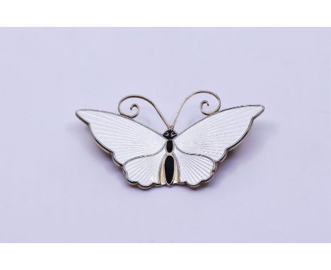 A David Andersen Norwegian sterling silver butterfly brooch, with ivory enamel and black body, stamped 'David Andersen Norway