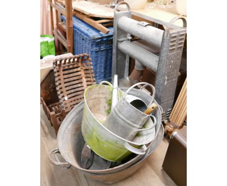 A collection of assorted metalware including a cast iron fire grate, galvanised tubs and a galvanised heater 