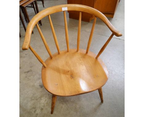 An Ercol Blonde elm and beech 338 model cowhorn chair 