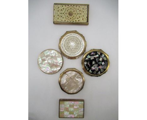 Stratton compact with Star carved in mother of pearl cover, a Stratton compact with flowers etched into mother of pearl cover