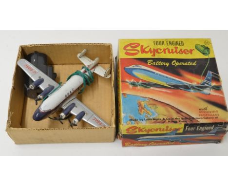 Vintage metal battery operated 4 engined Skycruiser in BOAC colours. Model by Louis Marx & Co, Hong Kong).Props will spin whe