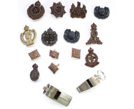 Selection of WW2 British economy plastic cap badges and pips (mainly by Stanley and Sons) together with a US Army 1943 whistl