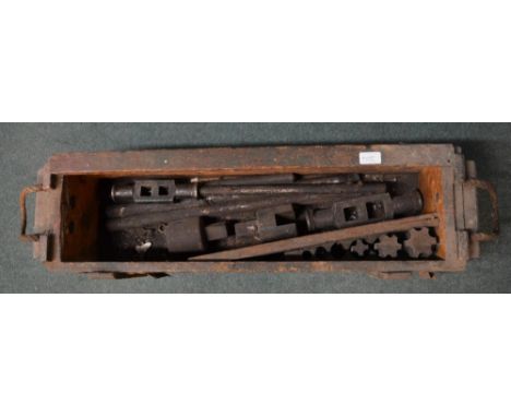 Military ammo box without lid containing number of tools for repairing and servicing tanks, including oversized tap drilling 