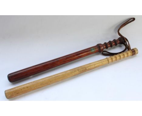 Two vintage military truncheons, one marked 'MP' for Military Police, the other with sticker for HMS Badger (WW2 period), lon
