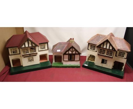 Two Tri-ang dolls houses, a similar outbuilding and a selection of miscellaneous vintage and modern dolls house furniture 