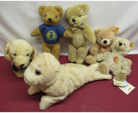 Collection of teddy bears including a Merrythought seal and Labrador, a Burberry bear with check bowtie and paw pads, two Ste