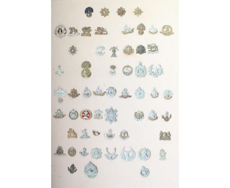 Selection of 59 mounted and framed British Army military cap badges, mainly mid-C20th with a few earlier and later examples, 