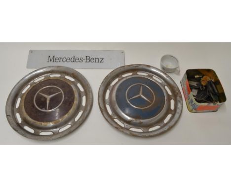 Two vintage Mercedes Benz wheel hubs D39cm, collection of Mercedes Benz and dealership key fobs including Landrover, Charles 