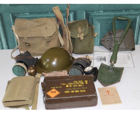 Military WWII &amp; later field equipment including Brodie helmet, cased gas mask and two other gas masks, water bottles, put