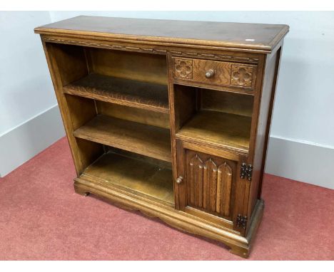Old Charm Oak Bookcase, with two shelves, cruciform carving to single drawer over cupboard door, featuring linen folds, on br