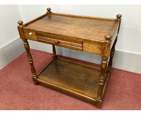 Oak Drinks Trolley, with single drawer to top shelf and lower shelf united by turned and block supports, 70cm wide.