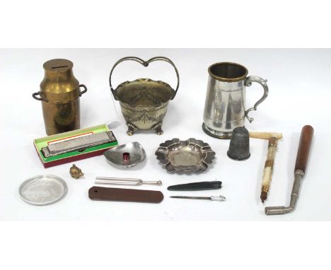 A metal 'Just a thimbleful' measuring cup, plated ashtray, goblet, 'Denmark' candle holder, basket, brass money box in the fo