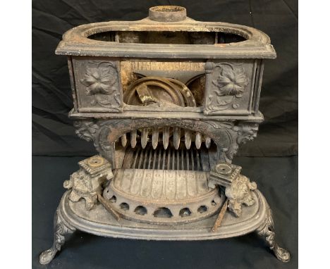 A French style cast iron wood burning stove, ‘The Queen’ model. 