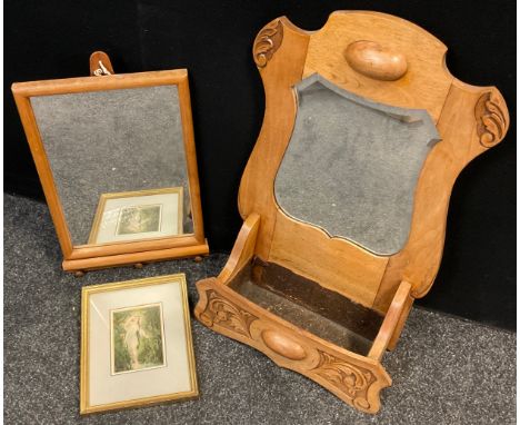 An Arts and Crafts style carved elm hall mirror, with trough planter section beneath, 65cm high x 43cm wide;  another small w