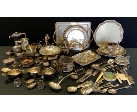 An Edwardian silver plated three piece tea set,  twin handled tray,  sauce boats, salver, dishes, Arts &amp; Crafts water jug