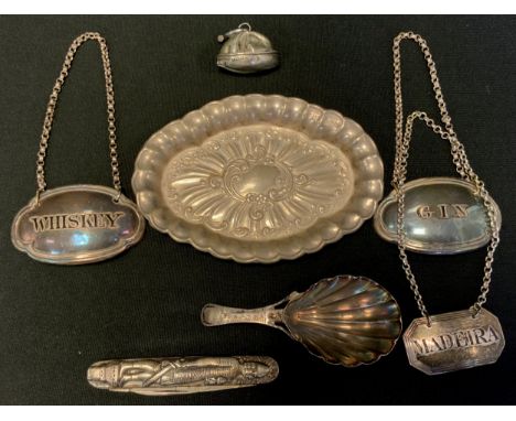 A George IV silver Decanter label, Madeira, London 1828;  others later plated;  white metal caddy spoon;  folding pocket knif