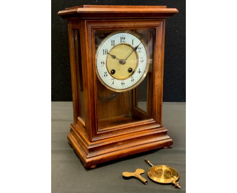 A walnut cased mantel clock, by the Hamburg Amerikanische Uhrenfabrik (HAC) company, 8-day fusee movement, glazed door and si