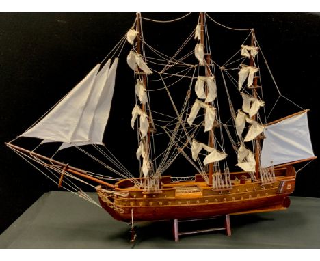 A wooden model of three masted sailing ship, 70cm high, 93cm long 