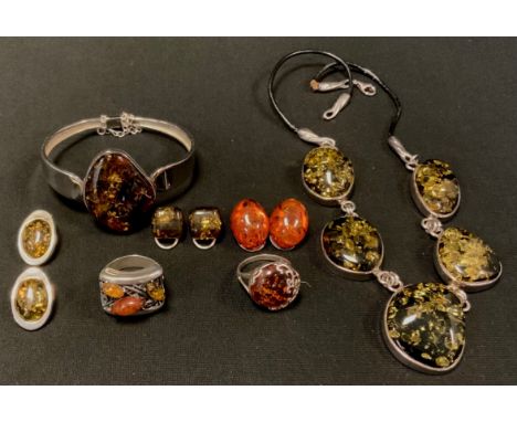 A Copal amber five panel necklace, silver coloured metal mounts, unmarked;  similar bangle, stamped 925,  two dress rings, th