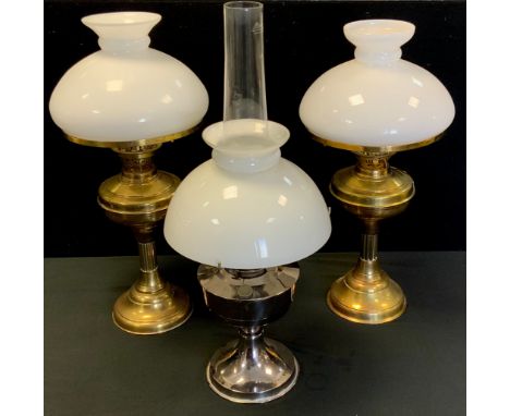 An early 20th century brass oil/paraffin lamp; others all with shades and chimneys (3) 