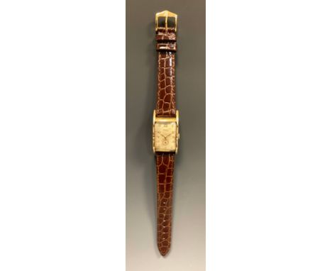 Gruen - a 1930s Curvex Precision rolled gold cased wristwatch, 41mm x 22mm step sided cruved case, silver dial, raised Arabic