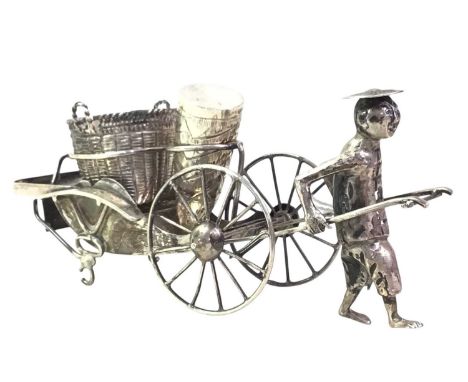 PART CHINESE WHITE METAL RICKSHAW CRUET SET, LATE 19TH / EARLY 20TH CENTURY modelled as a man pulling a rickshaw, likely silv