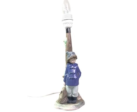 TWO NAO FIGURAL TABLE LAMPS, the first modelled with boy, the second with girlLarger 42cm including bulbQty: 2