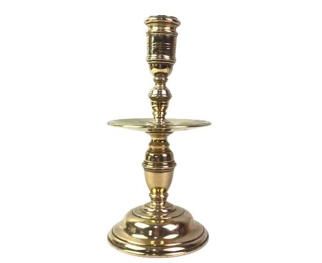 DUTCH BRASS HEEMSKIRK CANDLESTICK, ALONG WITH A COPPER TRAY  the 19th century candlestick with mid-column drip tray, the copp