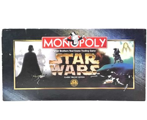 STAR WARS CLASSIC TRILOGY MONOPOLY, AND OTHER GAMES  comprising a Star Wars pin book and a Warhammer fantasy battle rules set