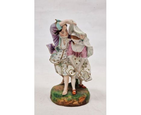 19th century French Gille (Jeune) bisque porcelain group&nbsp;of a pair of lovers running from the rain, on grassy mound base