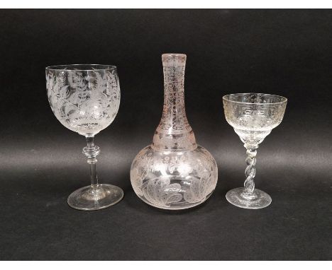 Mid 19th century engraved carafe and two wine glasses, the globular carafe engraved with stylised leaves and bands of foliate