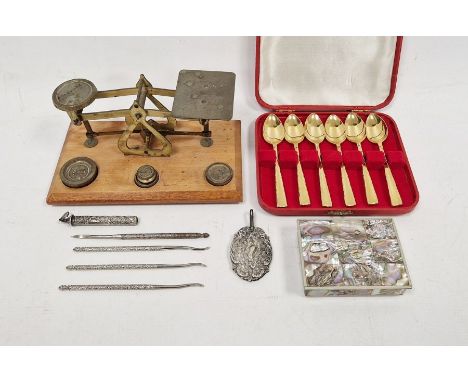 Early 20th century set of postal scales with weights, a cased set of six gilt teaspoons, a mother-of-pearl and white metal mo
