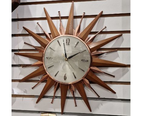 Mid century Metamec starburst wall clock, the silvered dial having baton hour markers with quarterly Arabic hour markers, qua